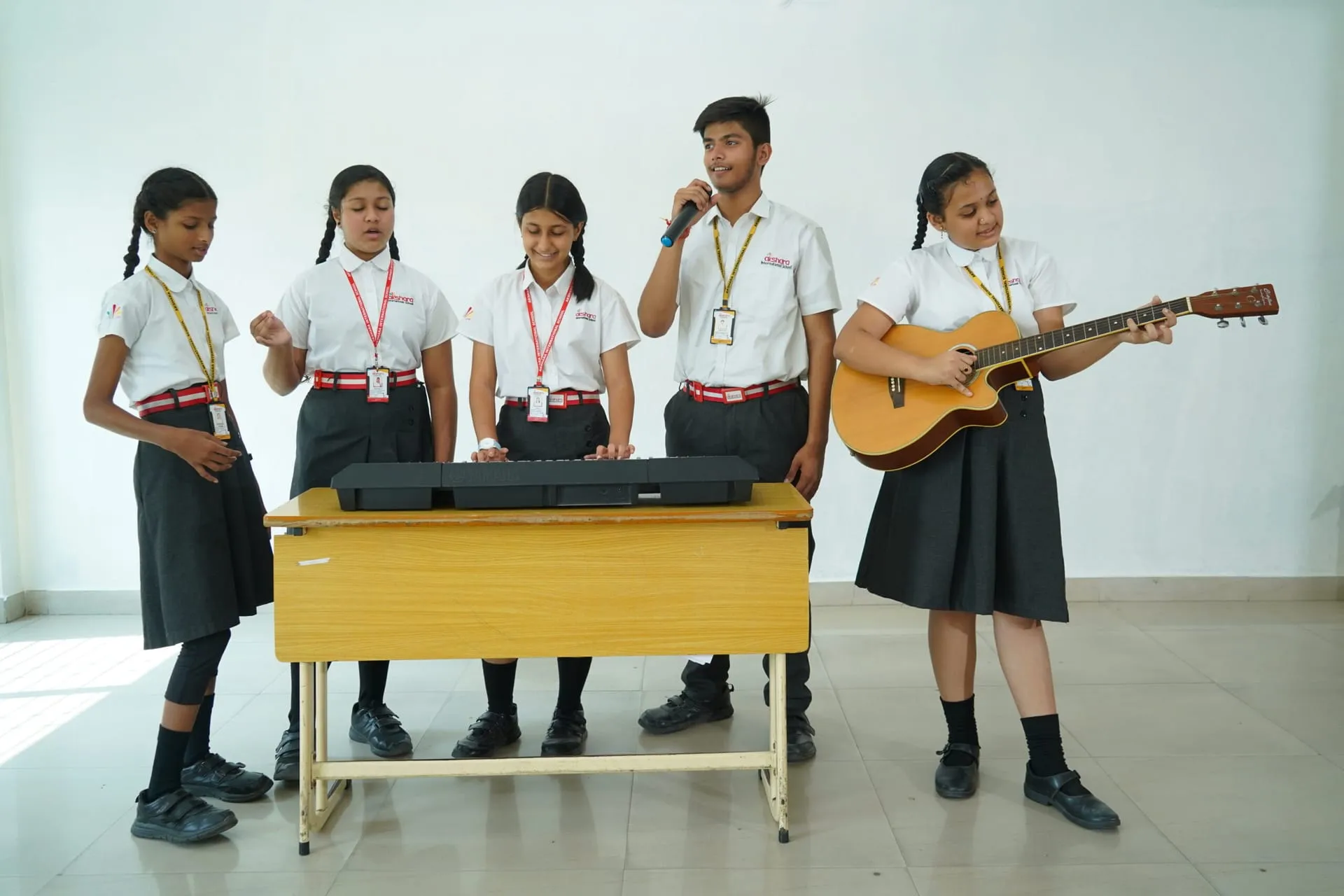 Akshara student music band with guitar, keyboard and vocals
