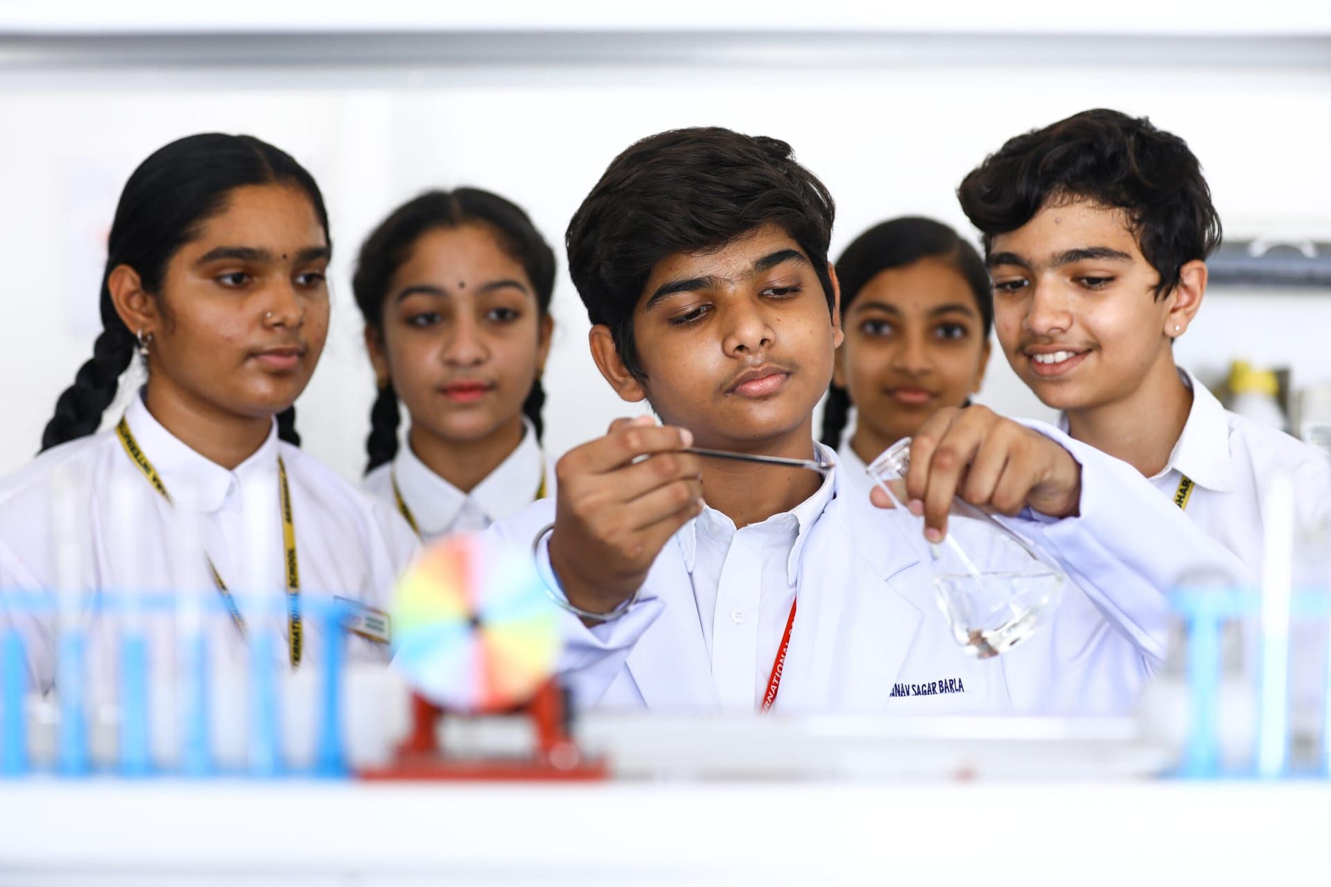 Group of Akshara students carrying out a science experiment together